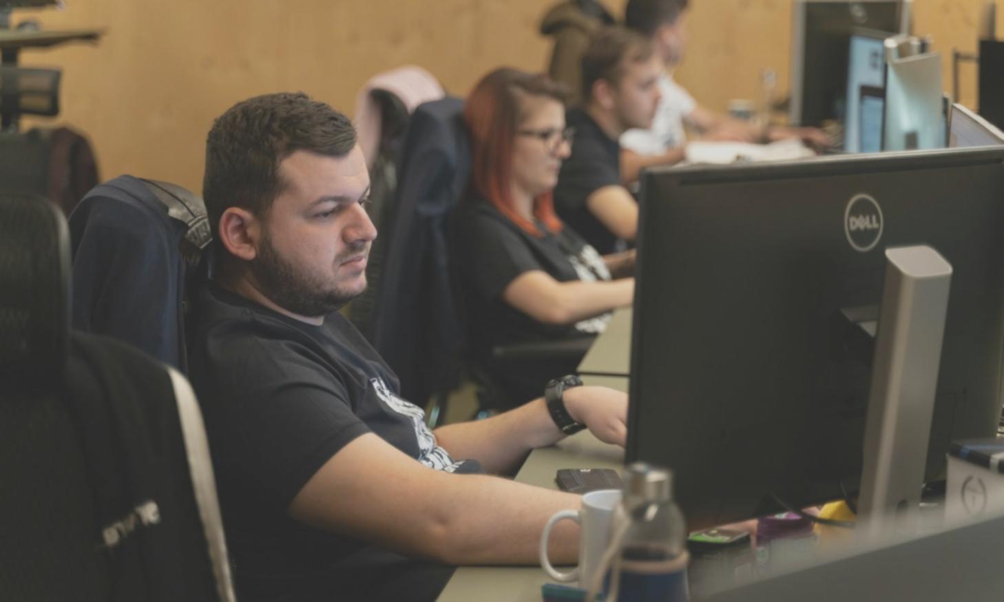 Financial planning workspace with calculator, documents and charts spread on desk